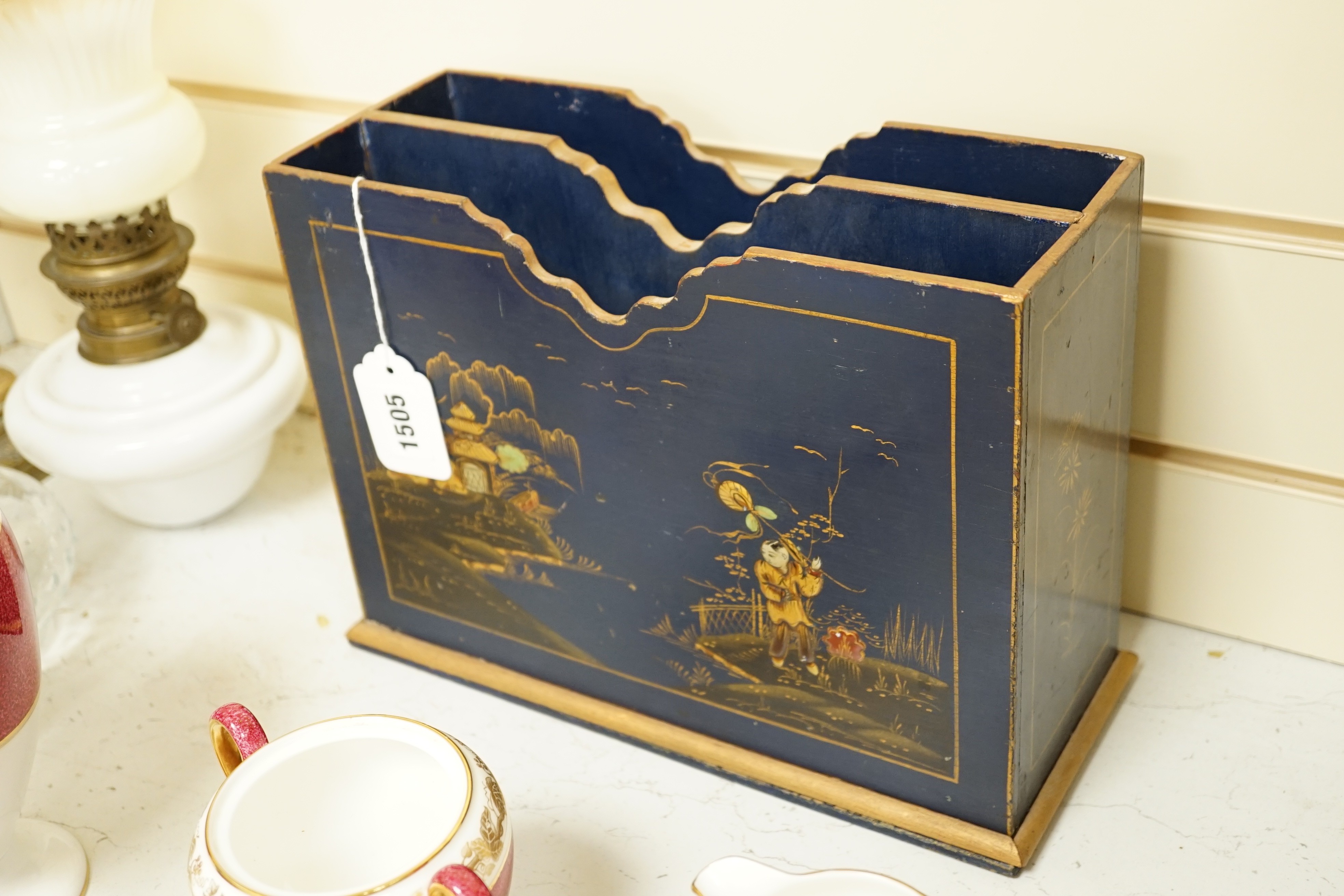 A 1920's chinoiserie lacquer two division paper rack, 22cms high